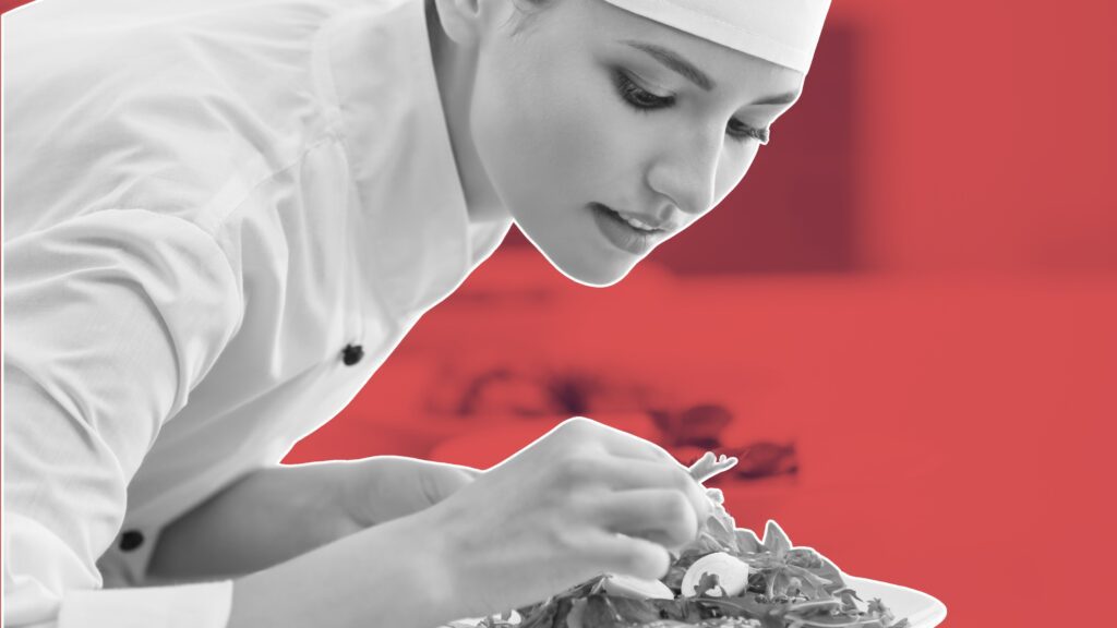 A professional chef multitasking in a modern kitchen, essential skills every chef must master