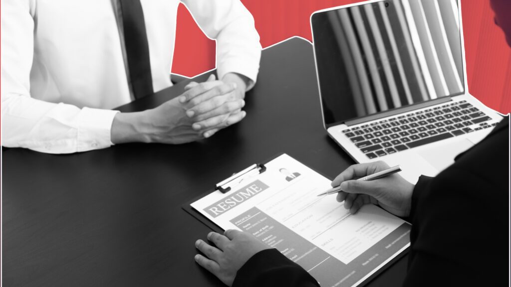 Hospitality manager coaching employee in restaurant setting