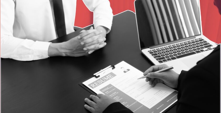 Hospitality manager coaching employee in restaurant setting