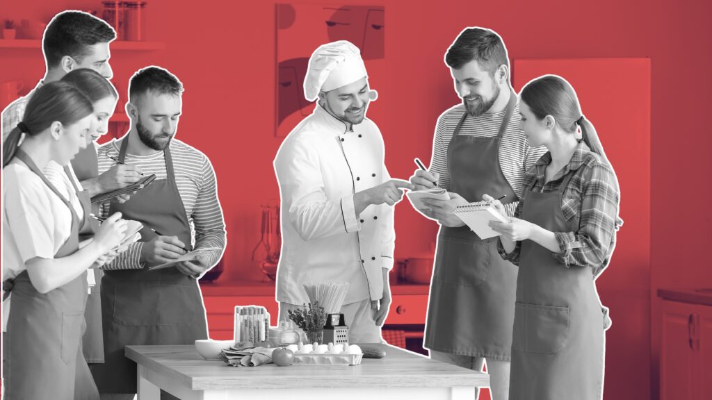 hospitality team laughing during a team-building game in the kitchen, free team building activities for hospitality staff