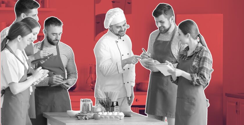 hospitality team laughing during a team-building game in the kitchen, free team building activities for hospitality staff