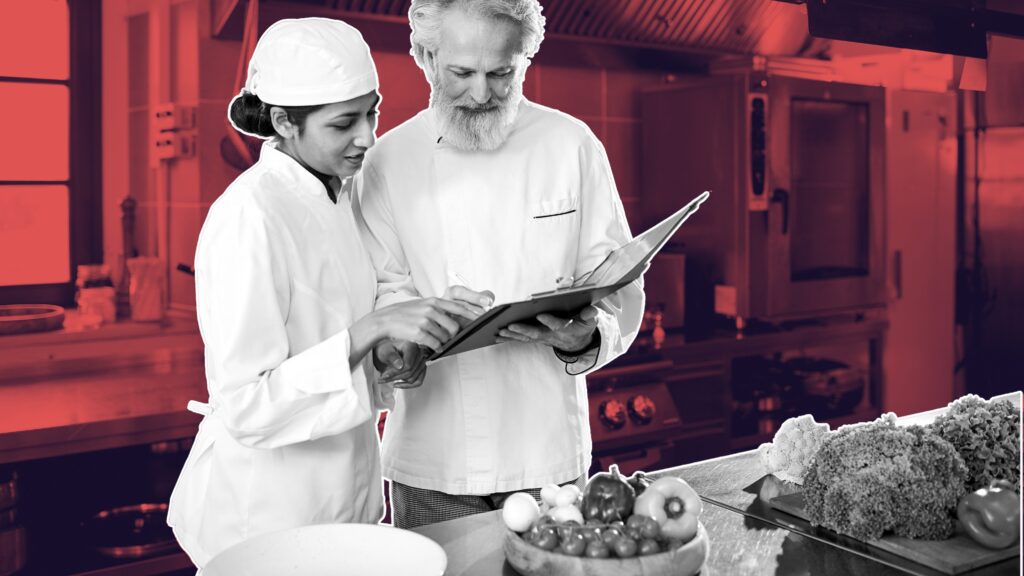 Chef reviewing free inventory management software template on kitchen tablet