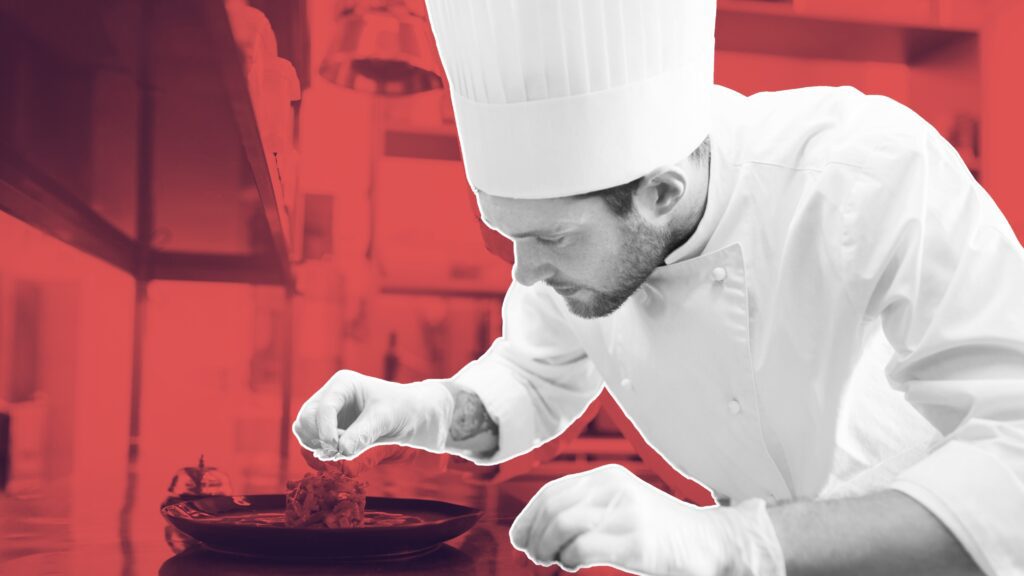 chef tracking earnings on a laptop with coffee