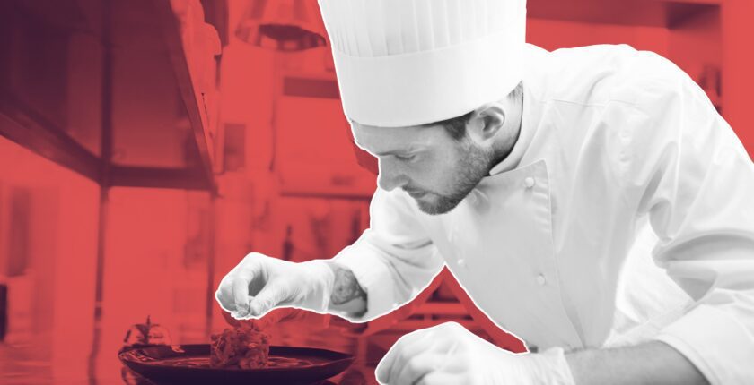 chef tracking earnings on a laptop with coffee