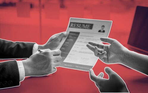 Chef planning a strategic plan for chef job search with resume and portfolio in a professional kitchen