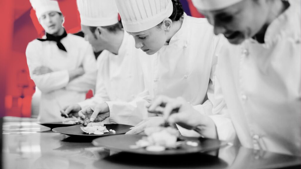 recruiter browsing chef profiles on laptop
