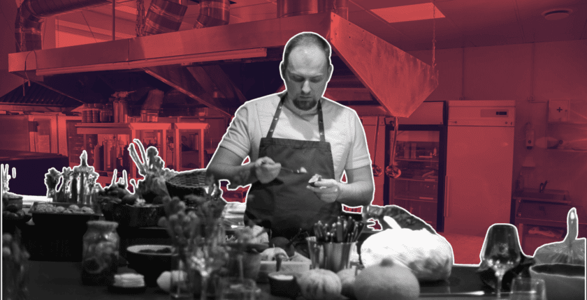 Chef marking waste log in busy prep area using waste reduction analytics toolkit