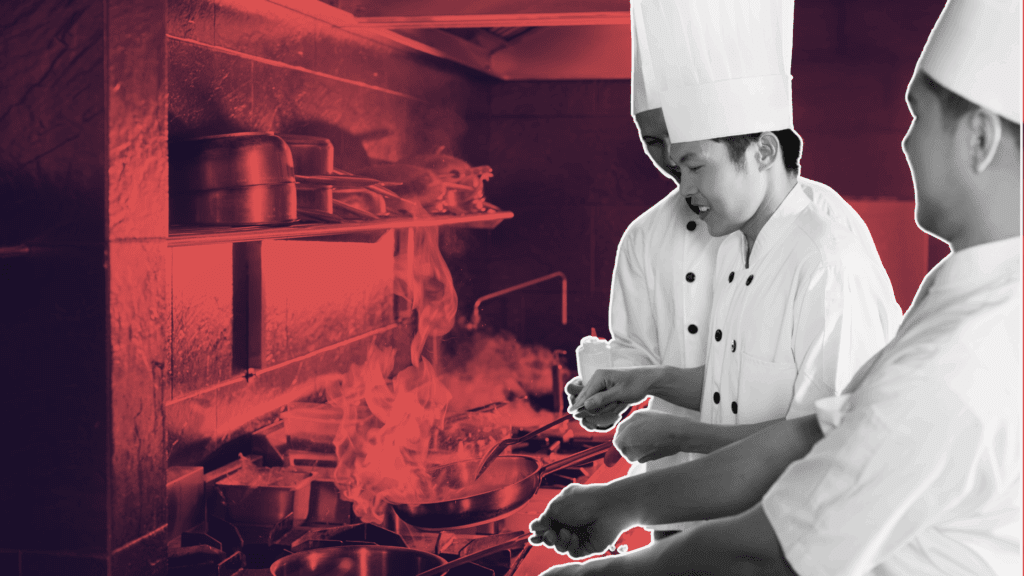 Hospitality employer reviewing chef CVs on laptop