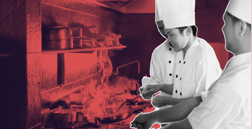 Hospitality employer reviewing chef CVs on laptop